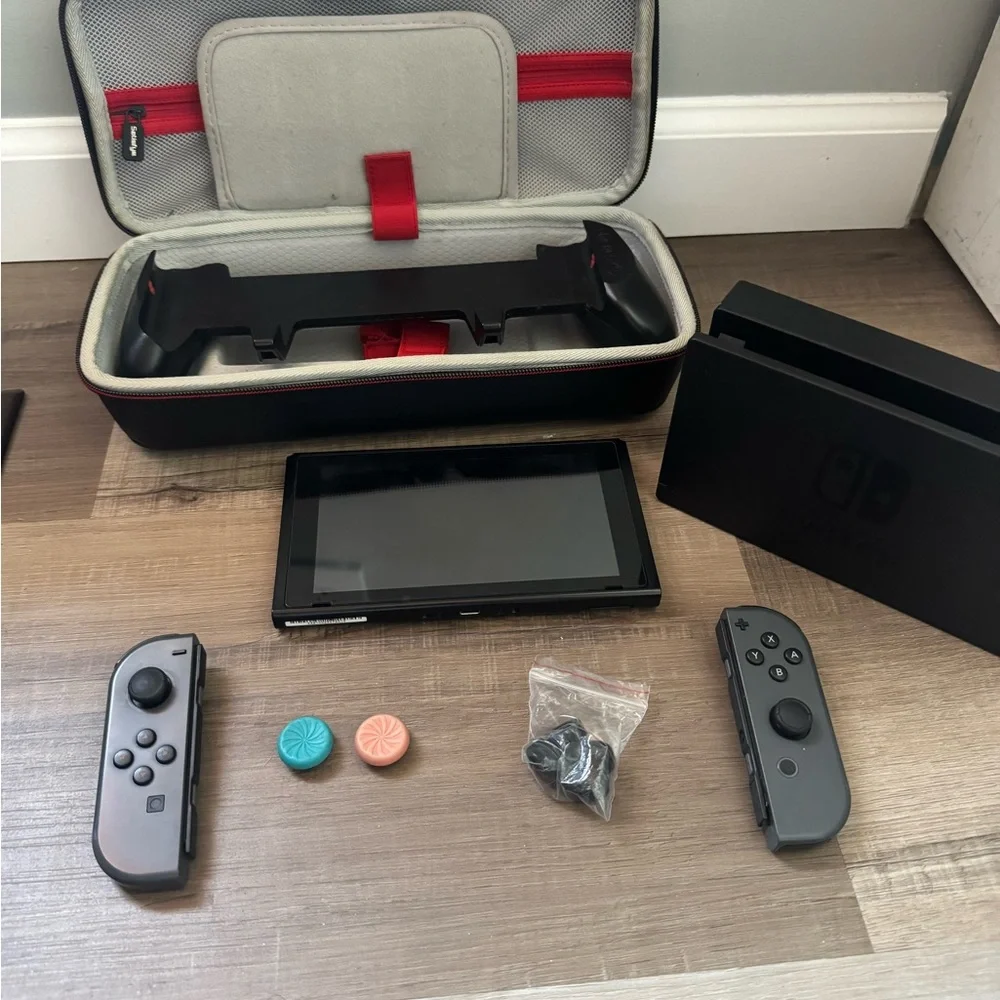 Nintendo Switch with Black and Gray Accessories